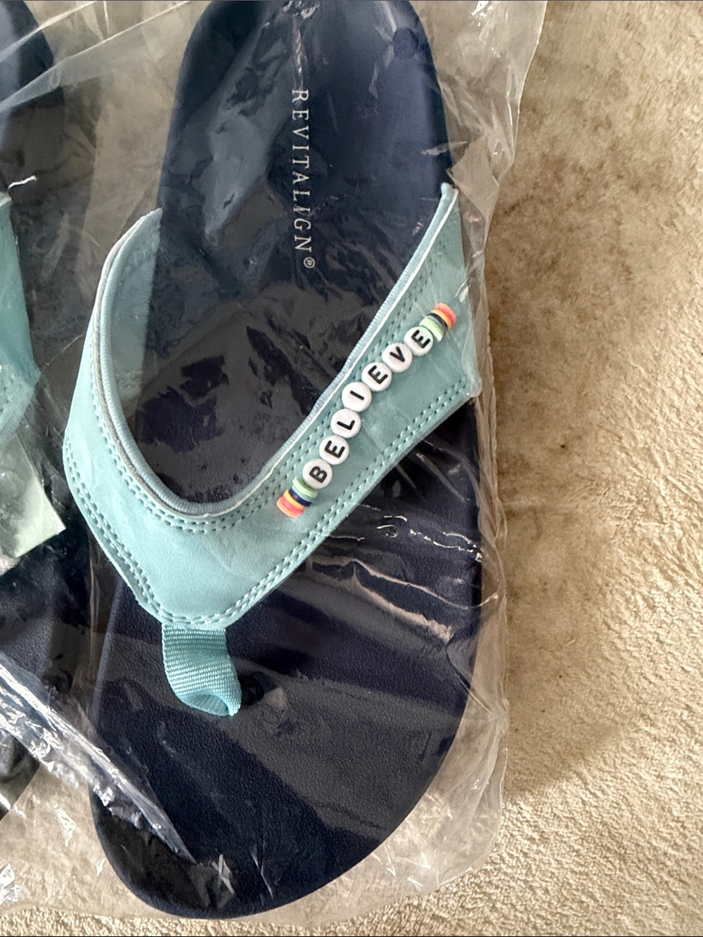 REVITALIGN Women’s Light Blue and Navy 'BELIEVE' Beaded Flip Flops
